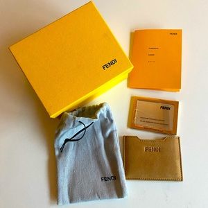 Brown suede Fendi suede mini mirror case with gold-tone hardware.